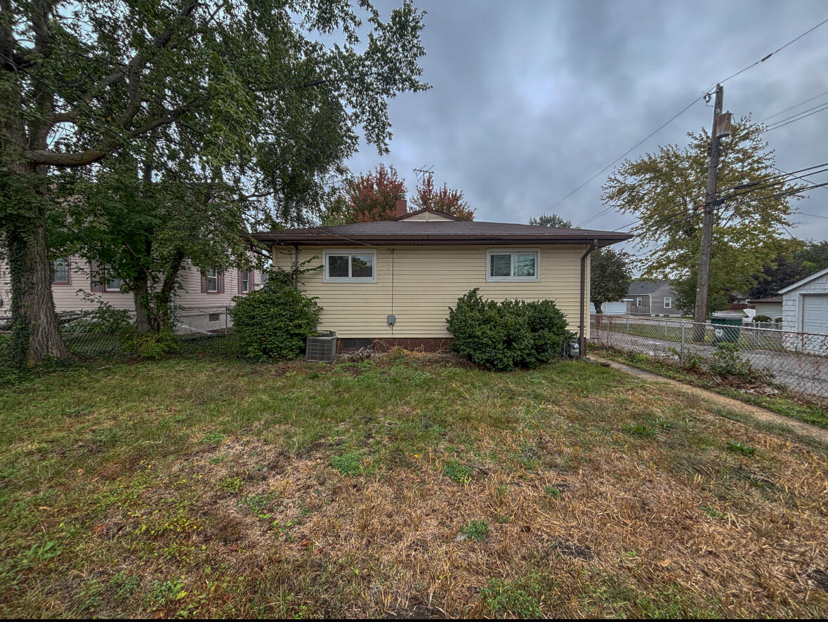 6844 Ridgeland Avenue Hammond, IN 46324 - Photo 20 of 21 a view of a house with a yard