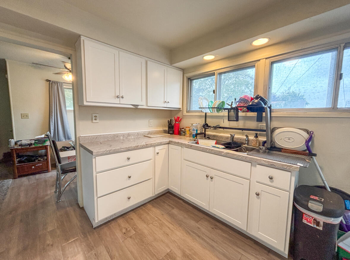 6844 Ridgeland Avenue Hammond, IN 46324 - Photo 6 of 21 a kitchen with granite countertop white cabinets and white appliances