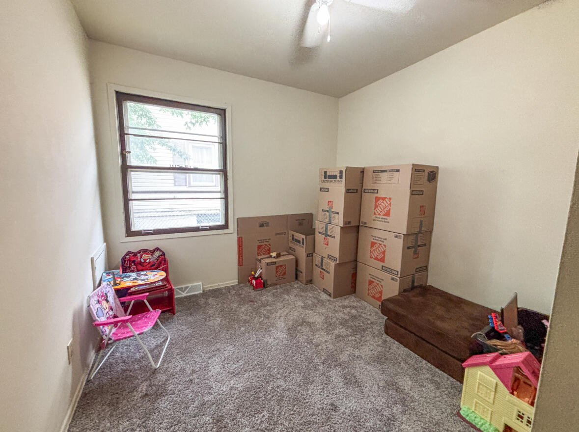 6844 Ridgeland Avenue Hammond, IN 46324 - Photo 9 of 21 a bedroom with furniture and a window