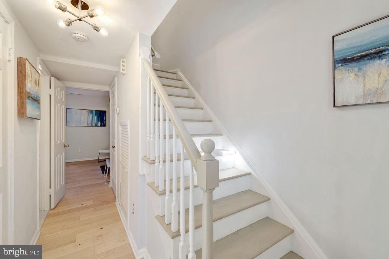 4940 Bradley Boulevard, Unit 247 Chevy Chase, MD 20815 - Photo 13 of 25 a view of entryway and hall with wooden floor