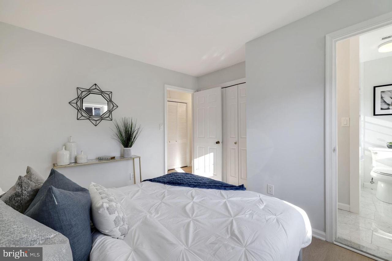 4940 Bradley Boulevard, Unit 247 Chevy Chase, MD 20815 - Photo 16 of 25 a bedroom with a bed and window