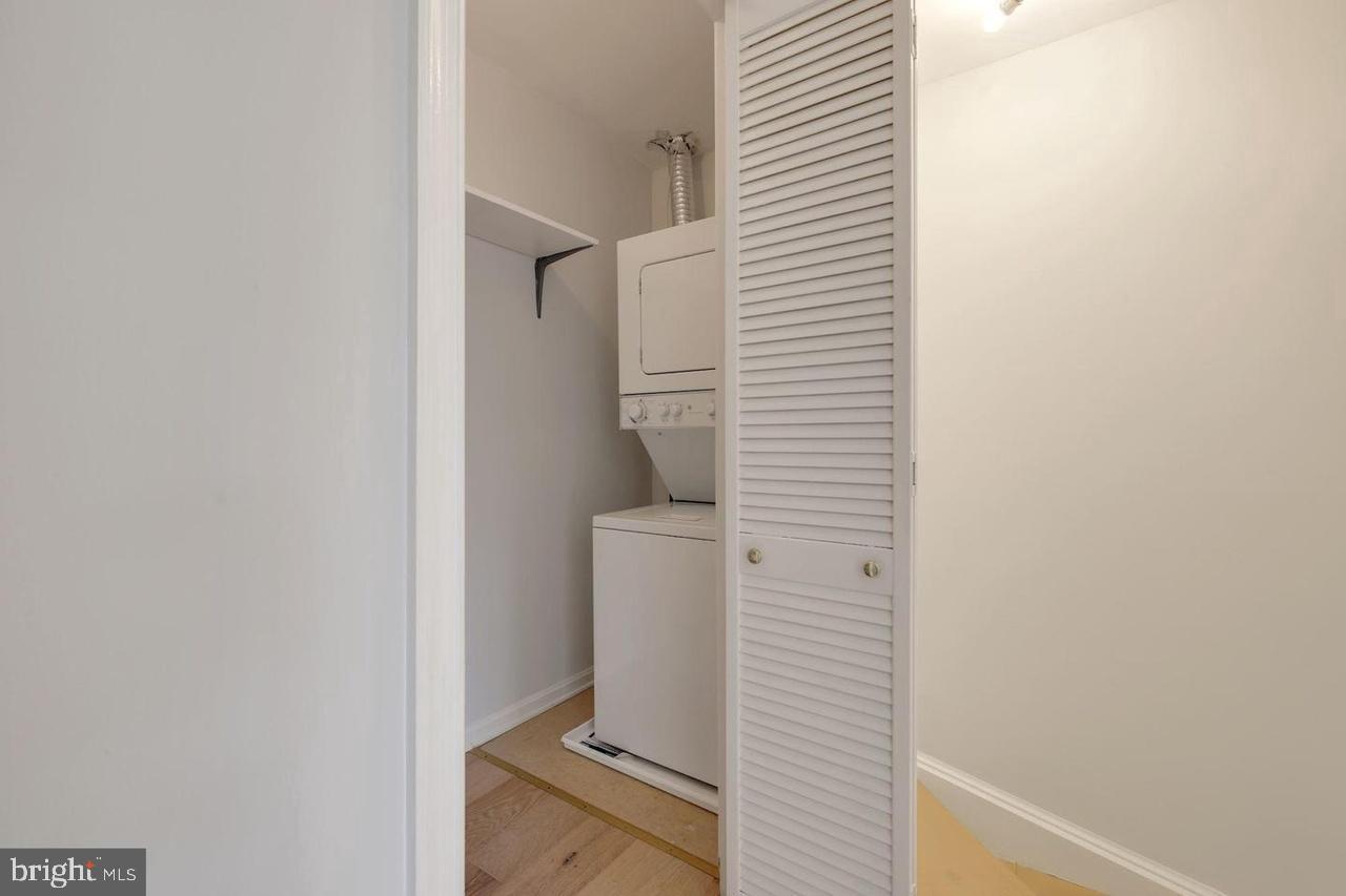 4940 Bradley Boulevard, Unit 247 Chevy Chase, MD 20815 - Photo 19 of 25 a bathroom with a toilet
