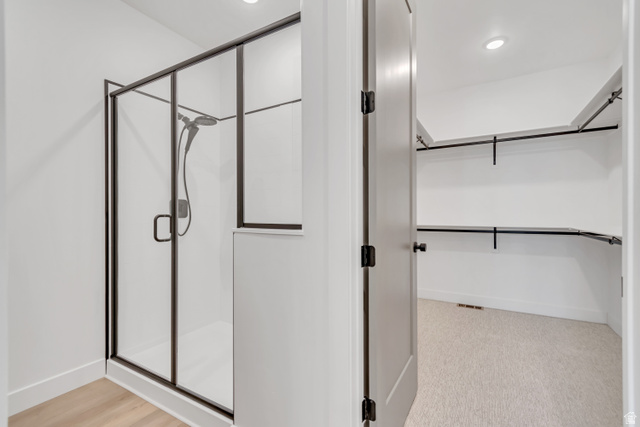 1302 1475 East, Unit 40 Payson, UT 84651 - Photo 23 of 34 Bathroom with a shower stall, recessed lighting, and a spacious closet