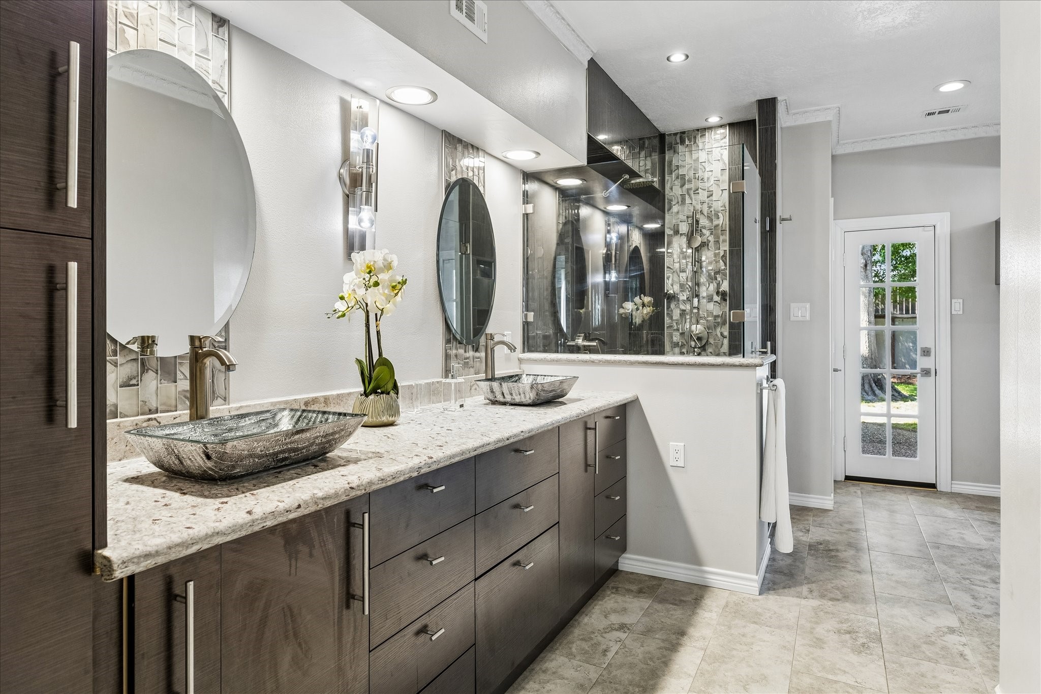 1030 Crossroads Drive Houston, TX 77079 - Photo 21 of 44 a bathroom with a granite countertop sink double vanity and a mirror