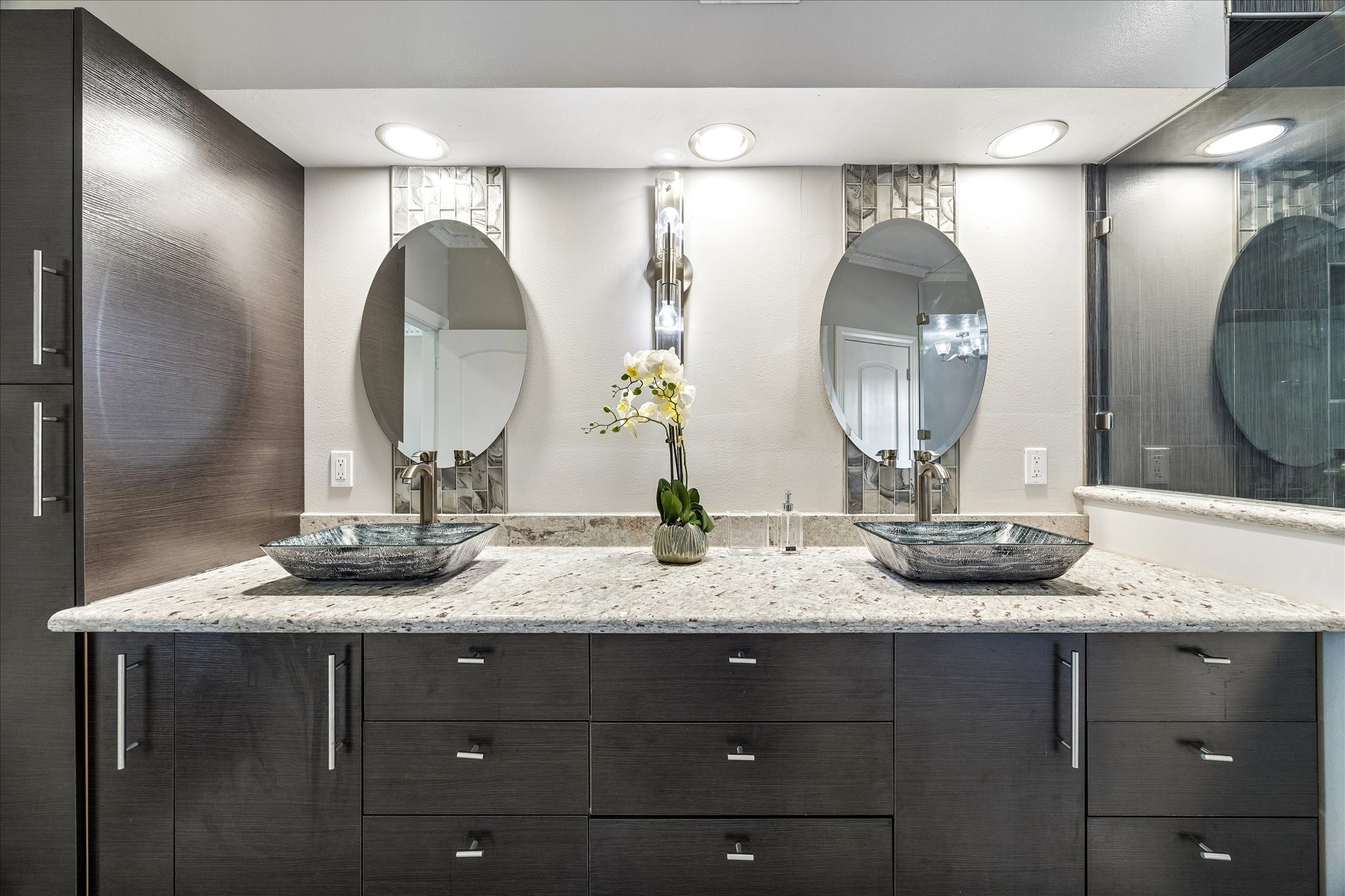 1030 Crossroads Drive Houston, TX 77079 - Photo 22 of 44 a bathroom with a granite countertop double vanity sinks and a mirror