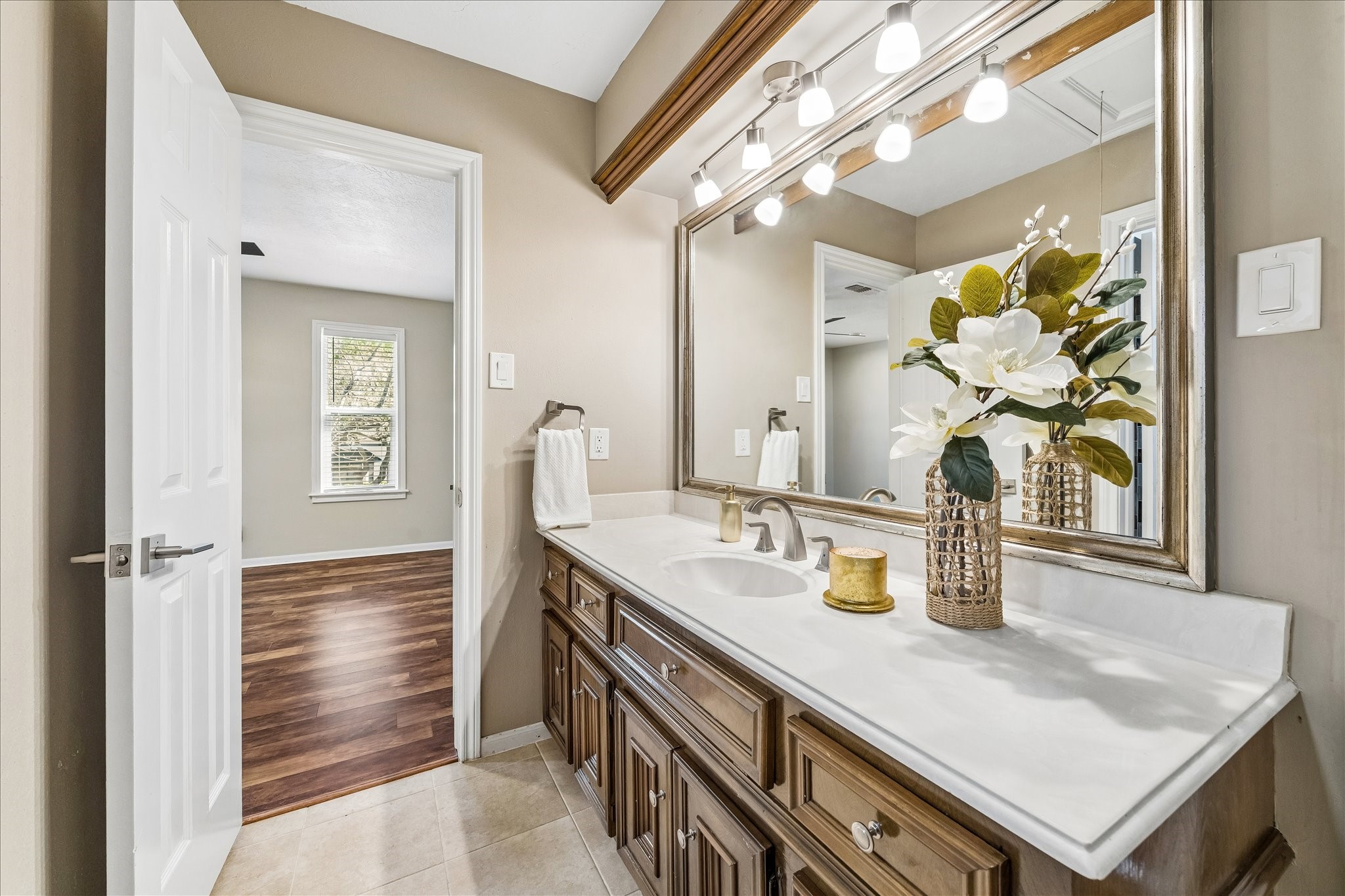 1030 Crossroads Drive Houston, TX 77079 - Photo 30 of 44 a bathroom with a sink a mirror and a shower