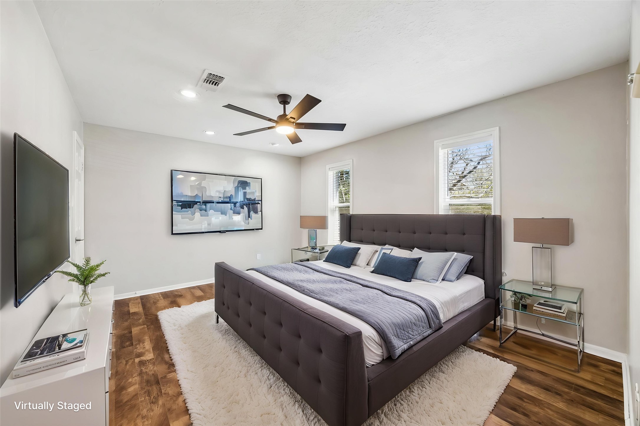 1030 Crossroads Drive Houston, TX 77079 - Photo 31 of 44 a bedroom with a large bed and a flat screen tv
