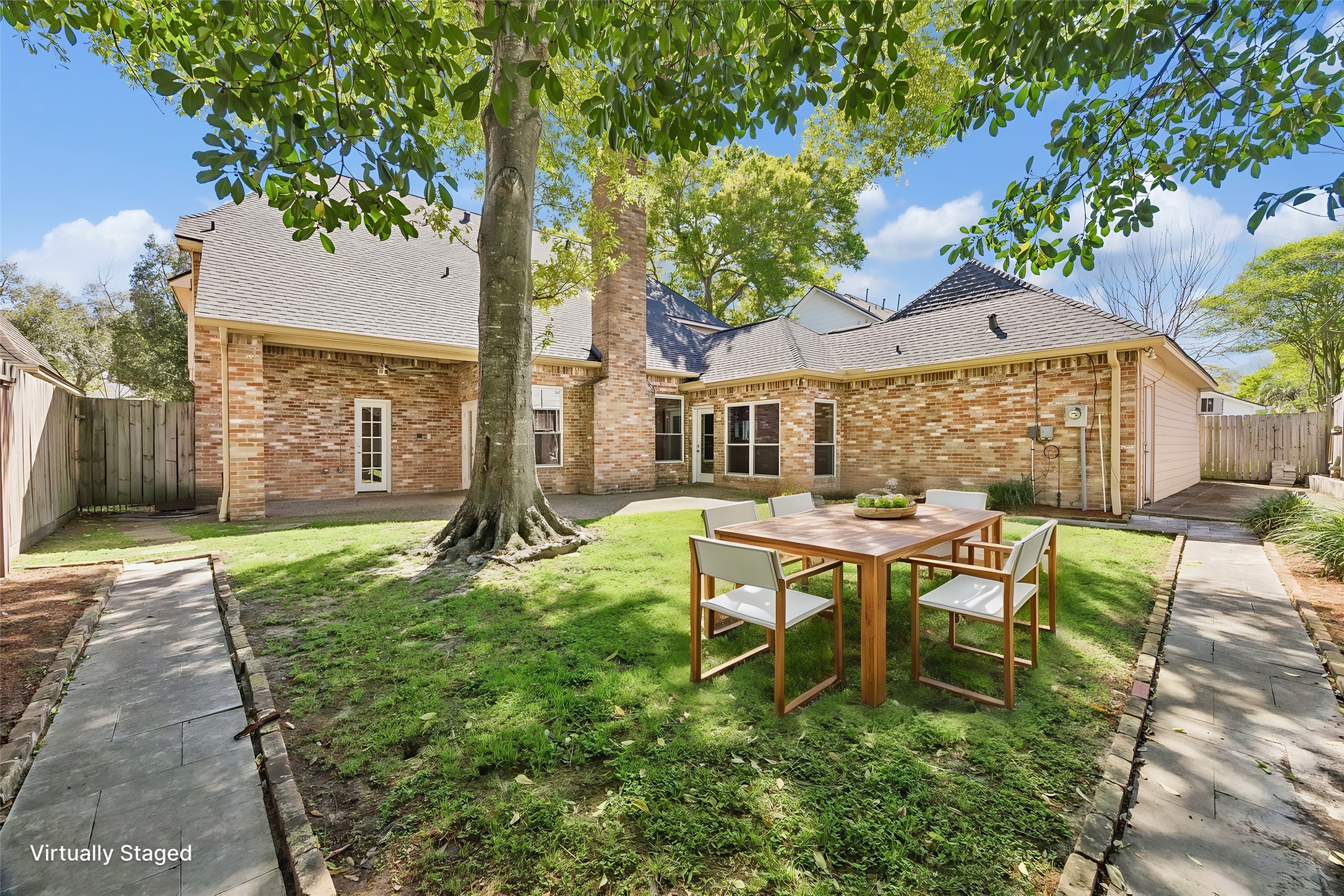 1030 Crossroads Drive Houston, TX 77079 - Photo 40 of 44 a view of a house with backyard and sitting area