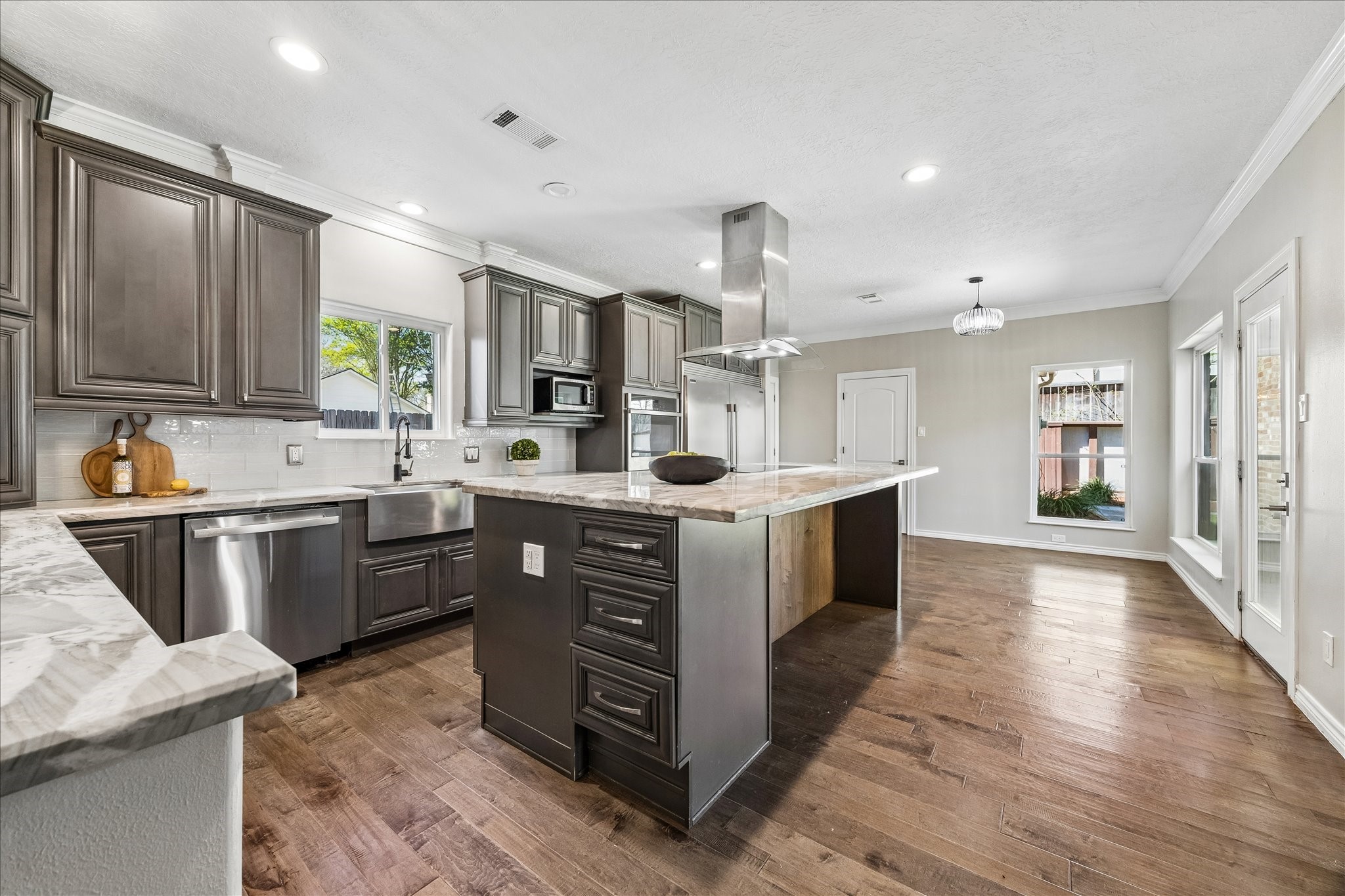 1030 Crossroads Drive Houston, TX 77079 - Photo 4 of 44 Chef's kitchen with DOUBLE WALL OVENS, built-in refrigerator/freezer, and wine/beverage cooler