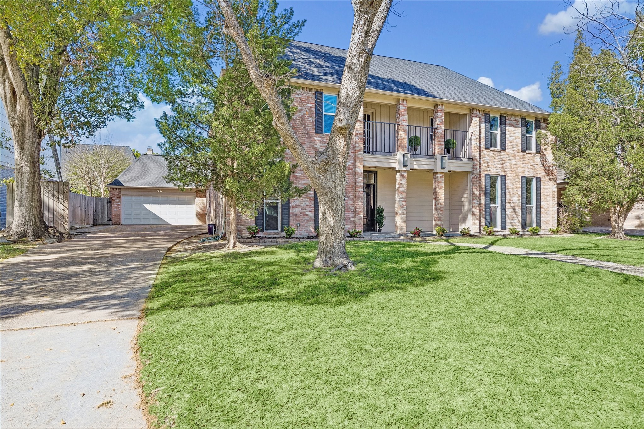 1030 Crossroads Drive Houston, TX 77079 - Photo 42 of 44 Incredible extended driveway providing easy parking and smooth in-and-out access to the OVERSIZED GARAGE, ideal for convenience and multiple vehicles.