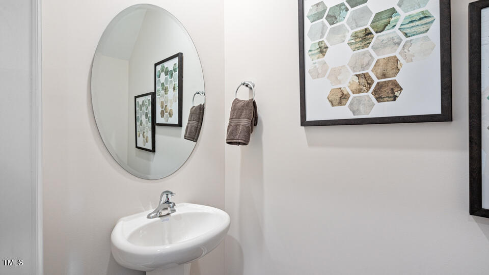 405 Belgian Red Way Rolesville, NC 27571 - Photo 15 of 28 a bathroom with a sink and mirror