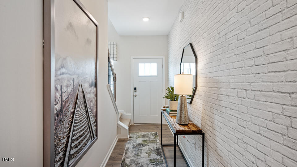 405 Belgian Red Way Rolesville, NC 27571 - Photo 2 of 28 a view of a hallway and a livingroom with furniture