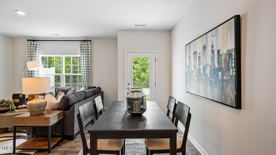 405 Belgian Red Way Rolesville, NC 27571 - Photo 6 of 28 a view of a dining room with furniture window and outside view