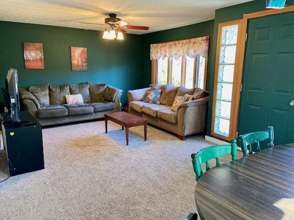 23 Adams Road Grafton, MA 01519 - Photo 11 of 32 a living room with furniture and a wooden floor