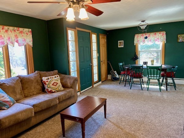 23 Adams Road Grafton, MA 01519 - Photo 12 of 32 a living room with furniture and a large window