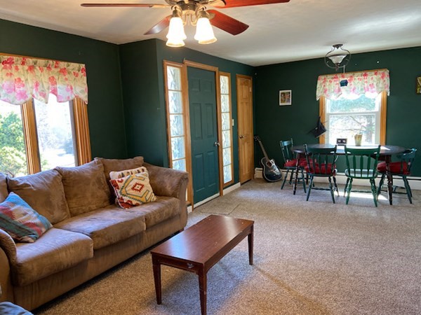 23 Adams Road Grafton, MA 01519 - Photo 15 of 32 a living room with furniture and a large window