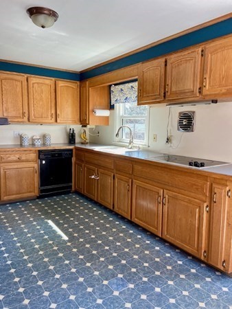 23 Adams Road Grafton, MA 01519 - Photo 17 of 32 a kitchen with stainless steel appliances granite countertop a sink stove and cabinets