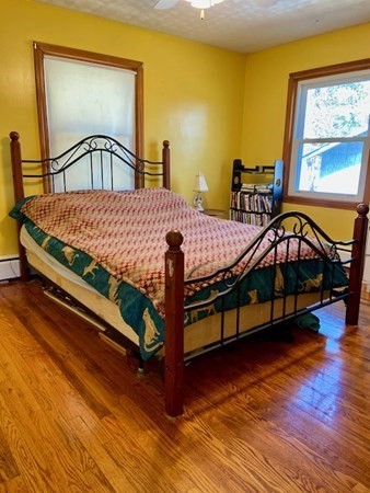 23 Adams Road Grafton, MA 01519 - Photo 21 of 32 a bedroom with a bed next to a window