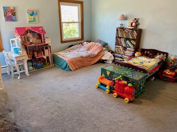 23 Adams Road Grafton, MA 01519 - Photo 25 of 32 a bedroom with kids bed and window