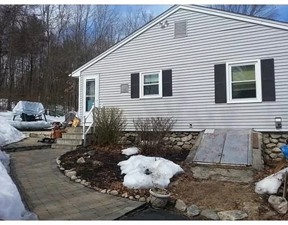 23 Adams Road Grafton, MA 01519 - Photo 3 of 32 a view of a house with a patio