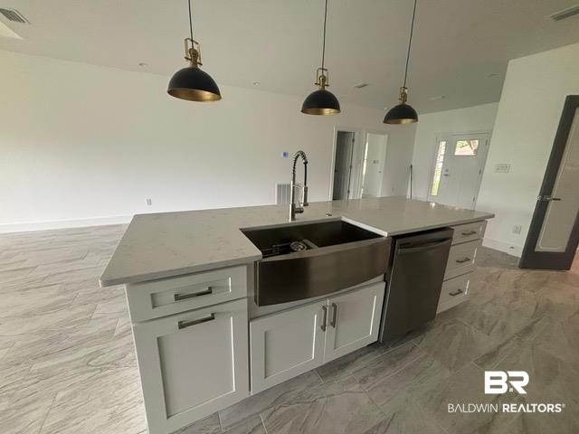 23348 Dundee Circle Foley, AL 36535 - Photo 20 of 21 Kitchen with stainless steel dishwasher, pendant lighting, white cabinets, an island with sink, and open floor plan