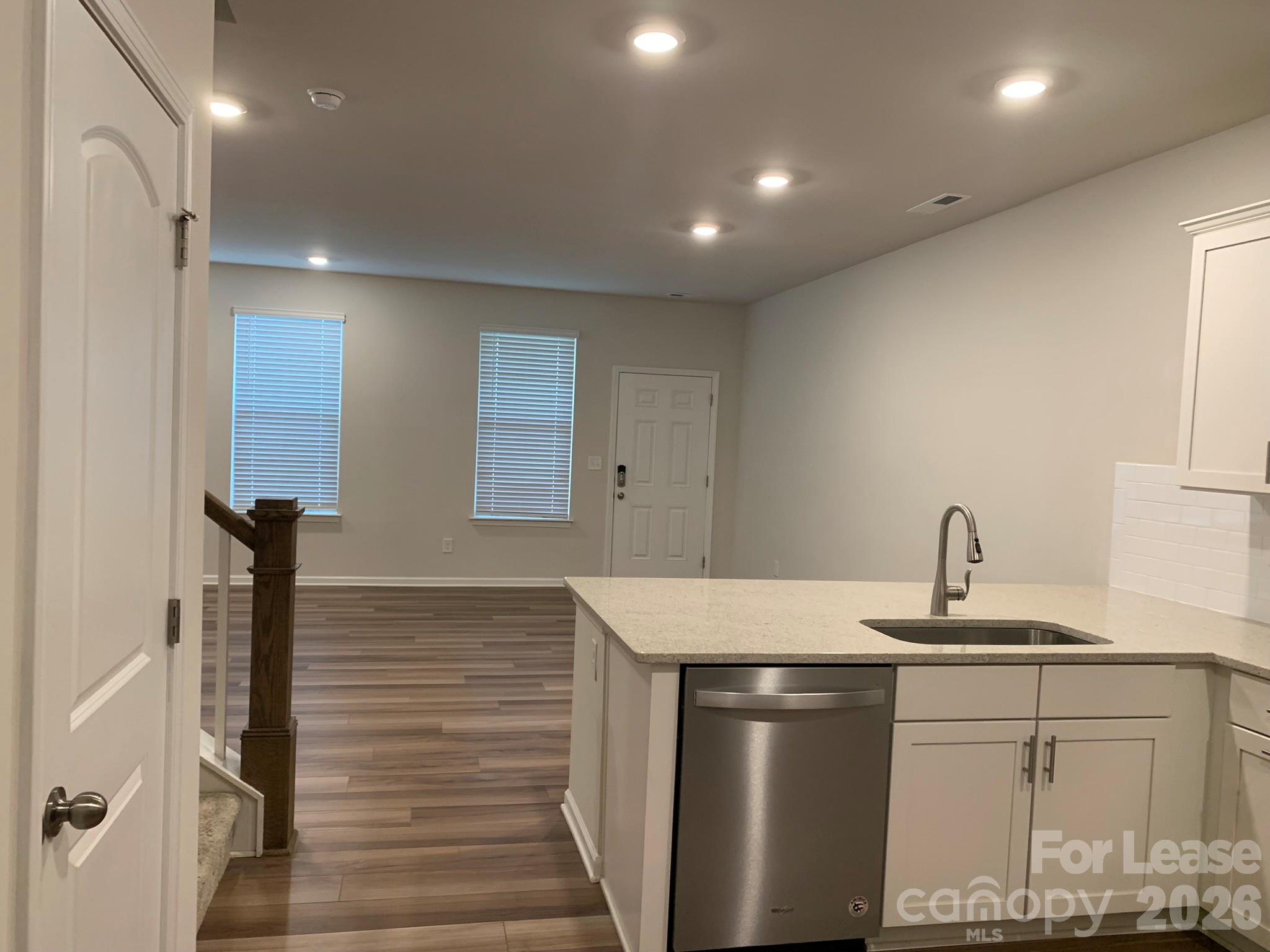 2143 Stevens Mill Road Matthews, NC 28104 - Photo 5 of 39 a kitchen with a sink and a refrigerator