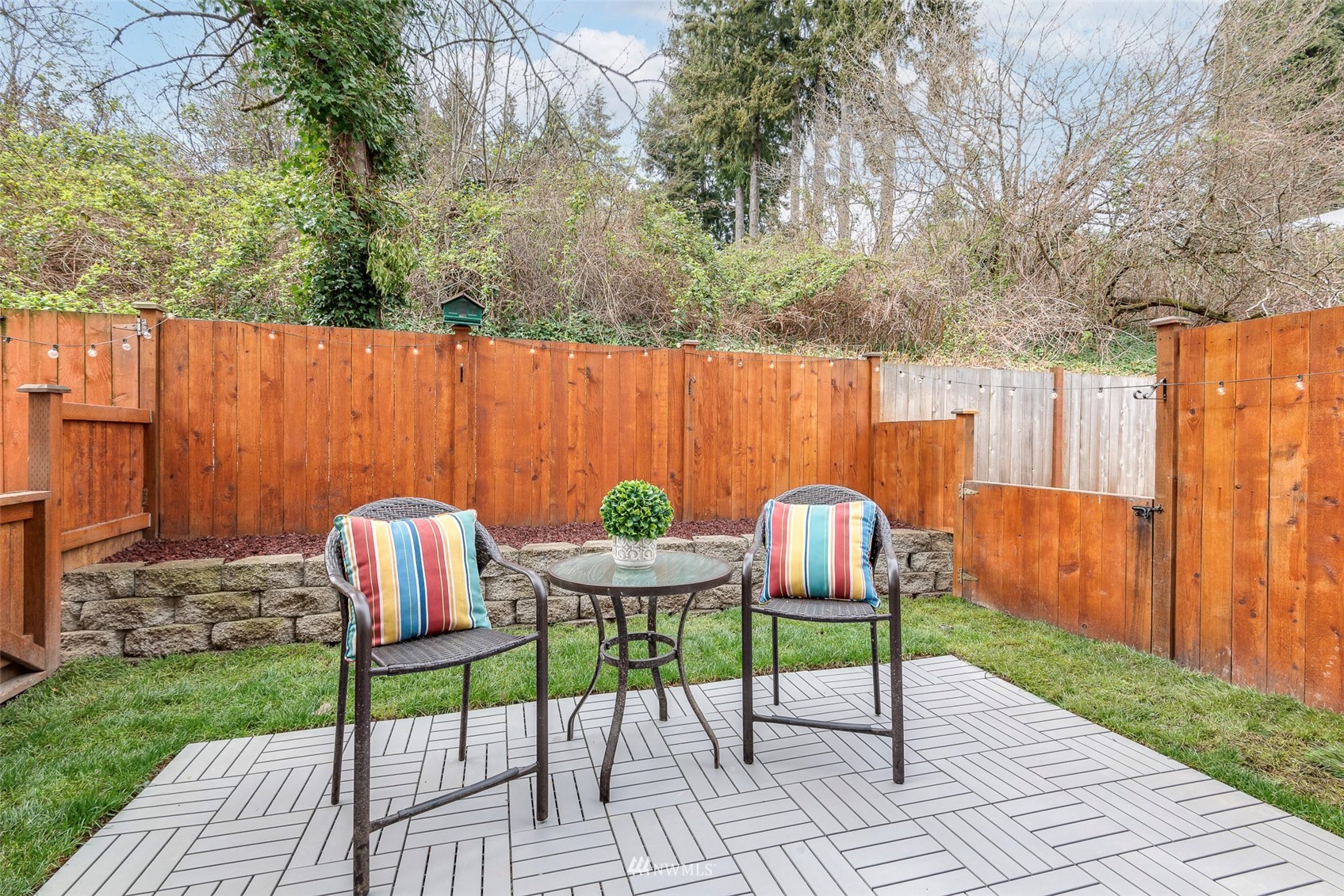 3420 Morrison Road West University Place, WA 98466 - Photo 33 of 40 a view of backyard with table and chairs and wooden fence