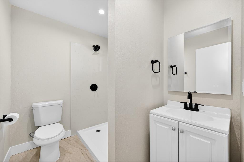 3901 Luneman Road Placerville, CA 95667 - Photo 16 of 56 a bathroom with a sink a toilet and shower