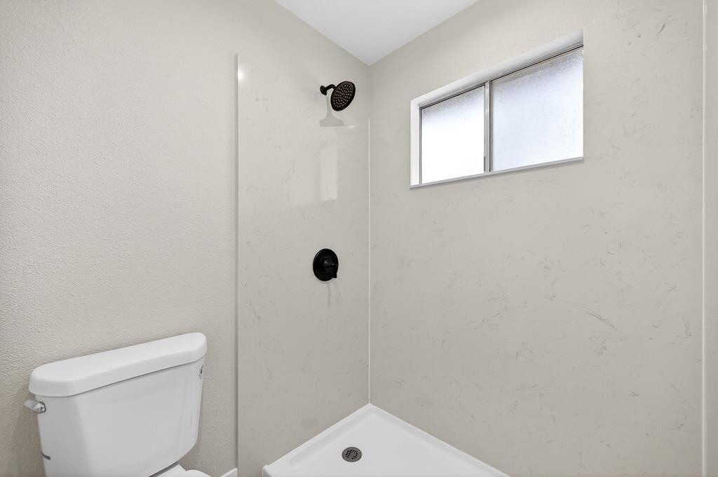 3901 Luneman Road Placerville, CA 95667 - Photo 17 of 56 a bathroom with a toilet and a shower