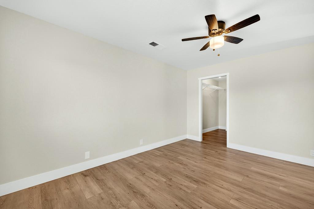 3901 Luneman Road Placerville, CA 95667 - Photo 18 of 56 an empty room with wooden floor closet and ceiling fan