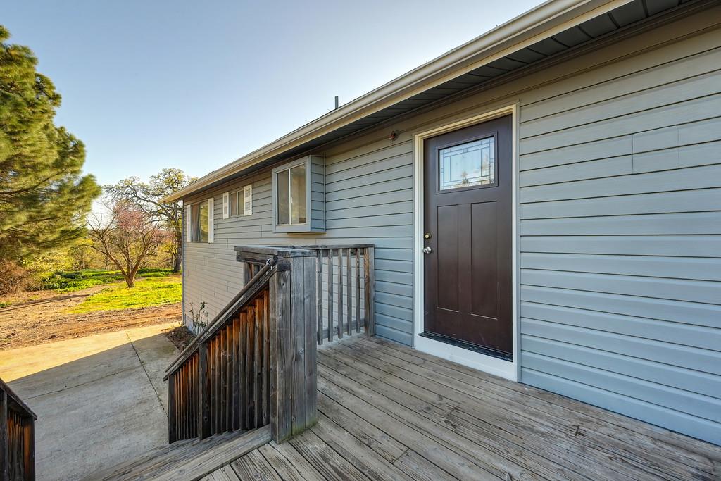 3901 Luneman Road Placerville, CA 95667 - Photo 26 of 56 a view of a wooden deck besides a house