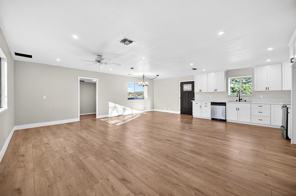 3901 Luneman Road Placerville, CA 95667 - Photo 5 of 56 a view of a kitchen with a sink and a stove top oven