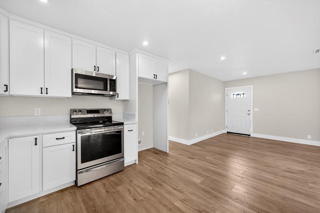 3901 Luneman Road Placerville, CA 95667 - Photo 10 of 56 a kitchen with stainless steel appliances a stove a sink and a microwave