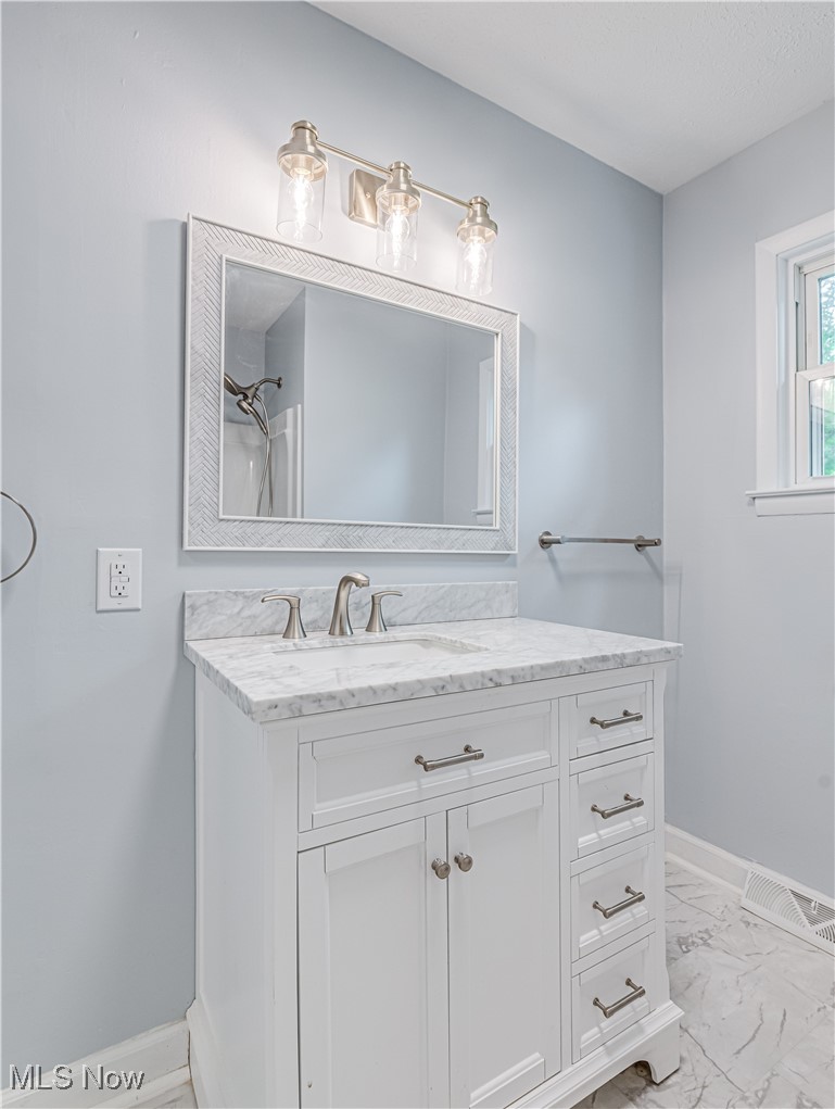 3667 Morrow Road Kent, OH 44240 - Photo 14 of 14 Completely updated full bathroom with a tub shower combo, raised vanity with granite top.