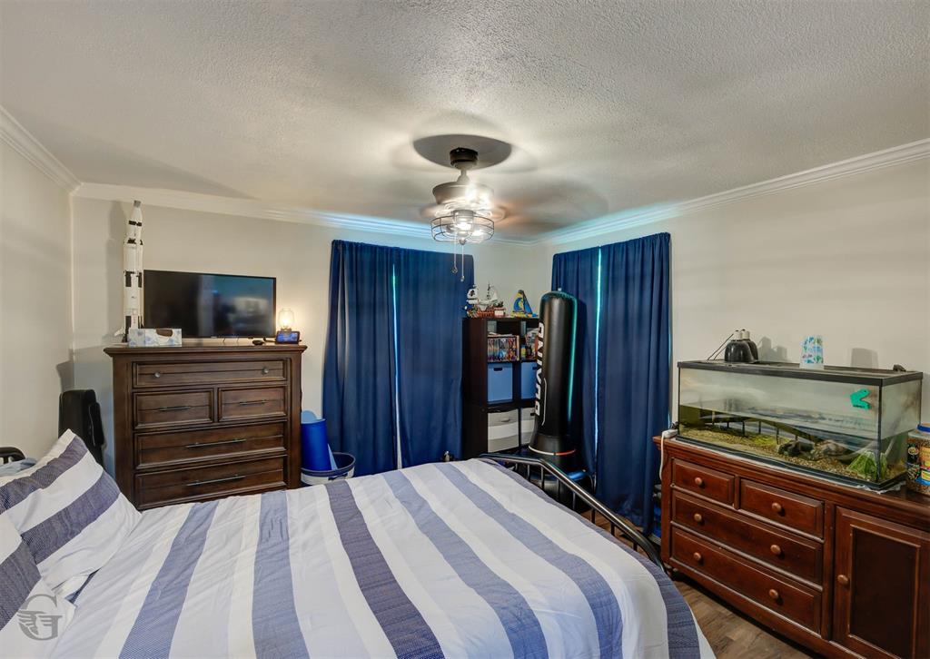 701 Chandler Road Haughton, LA 71037 - Photo 12 of 25 a bedroom with a bed and flat screen tv
