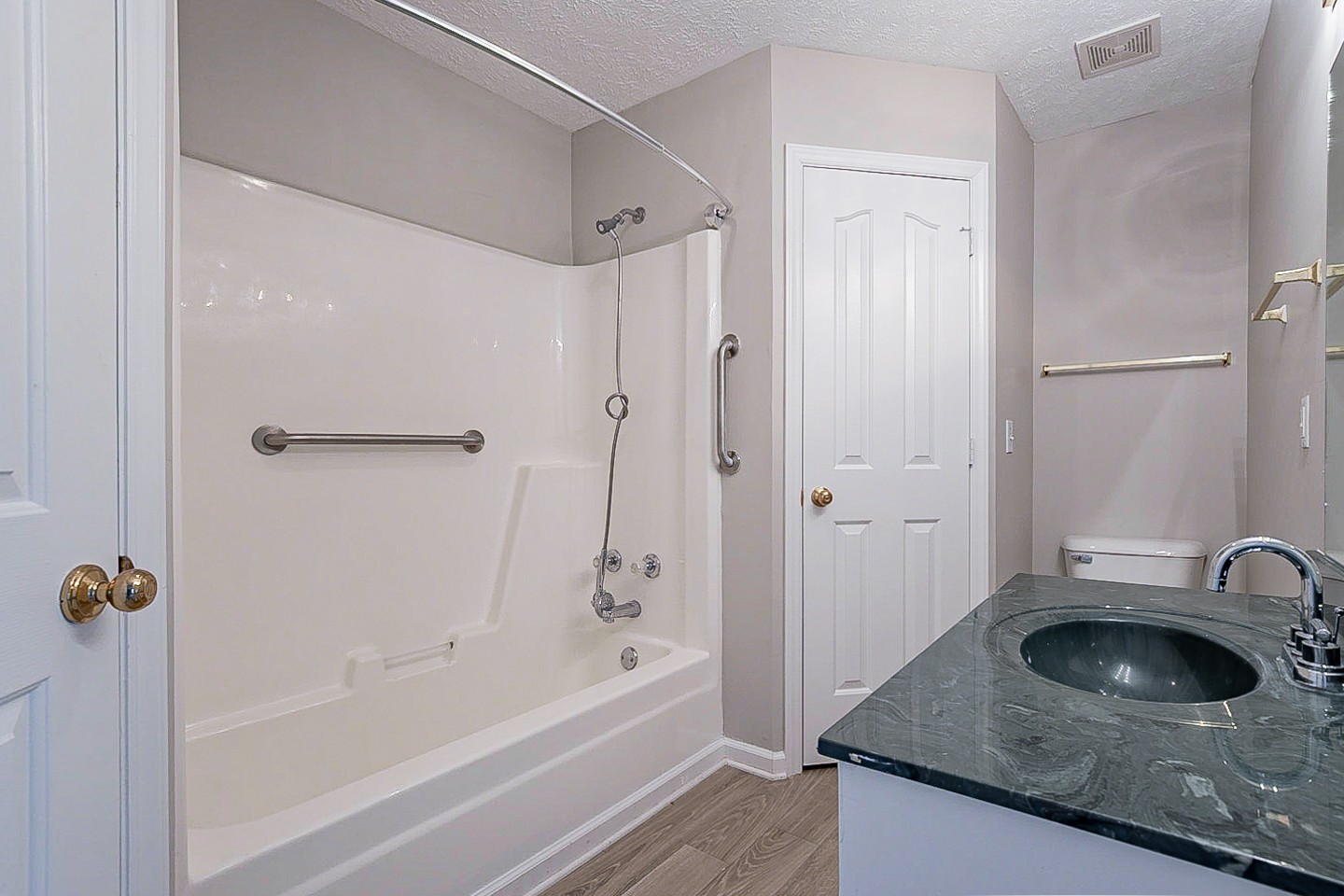 692 Crescent Road Murfreesboro, TN 37128 - Photo 18 of 23 a bathroom with a granite countertop sink a mirror and a bathtub
