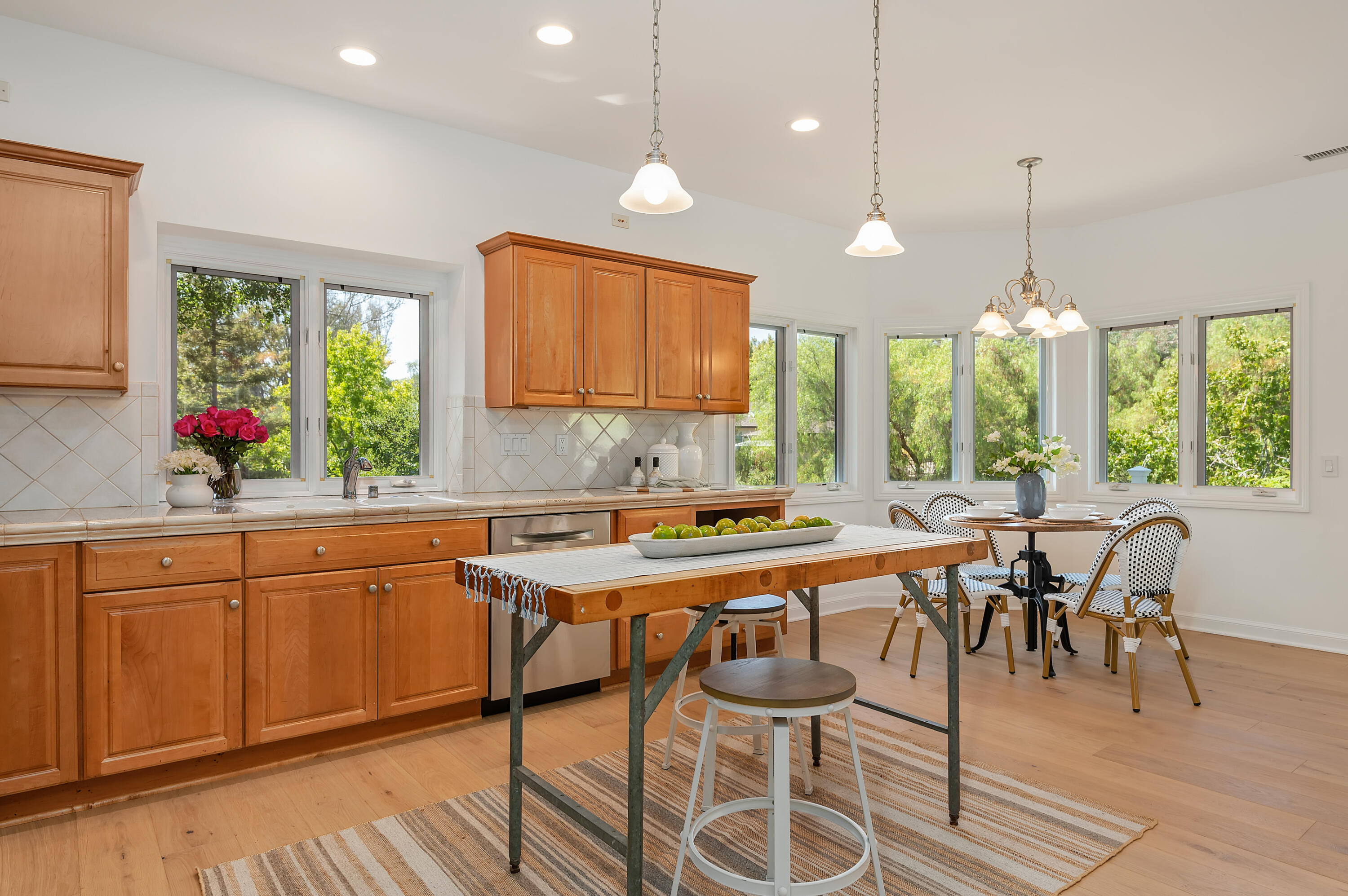 3848-2 Crescent Drive Santa Barbara, CA 93110 - Photo 11 of 32 a kitchen with a table chairs sink and cabinets