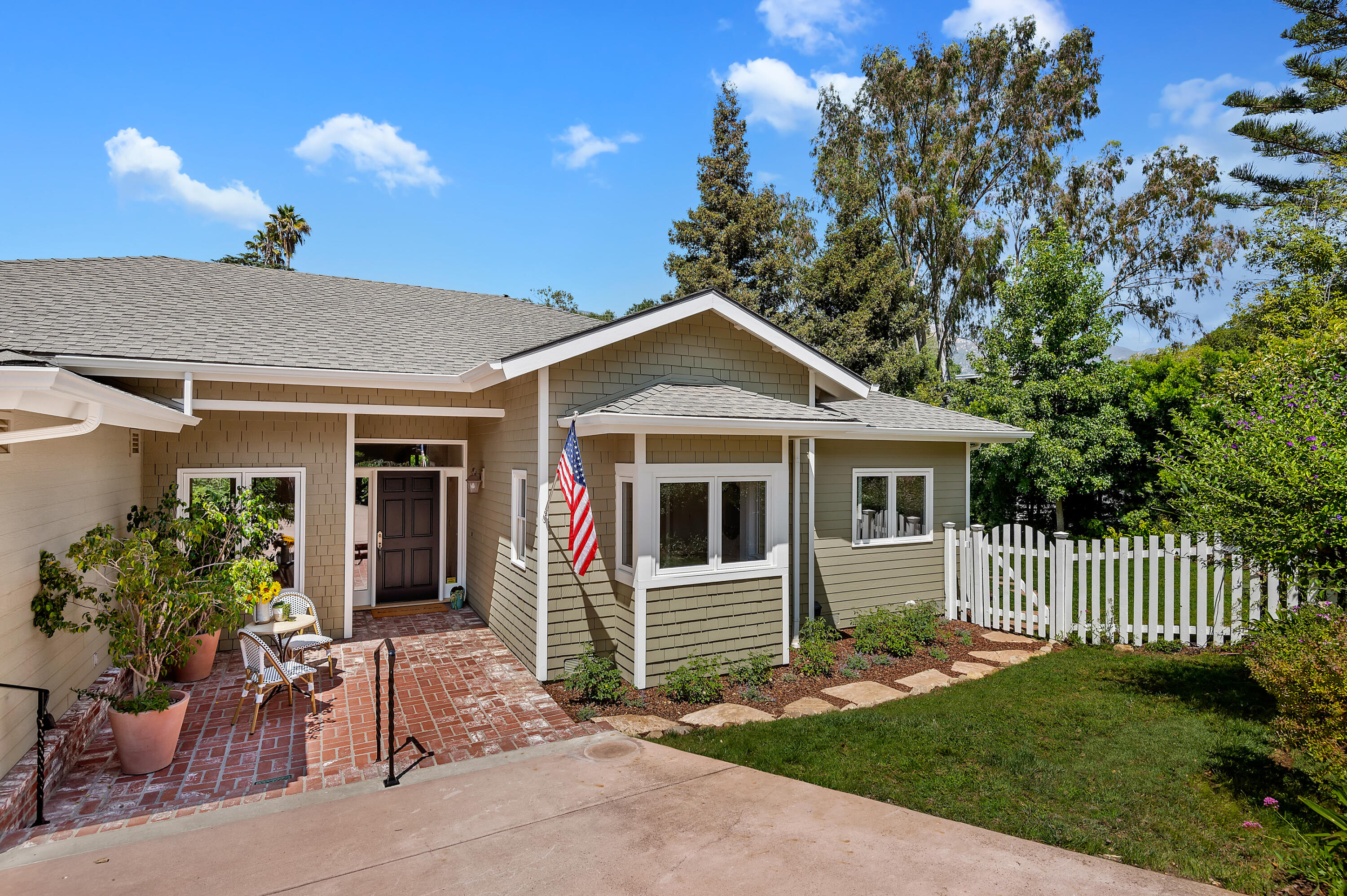3848-2 Crescent Drive Santa Barbara, CA 93110 - Photo 2 of 32 a front view of a house with a garden
