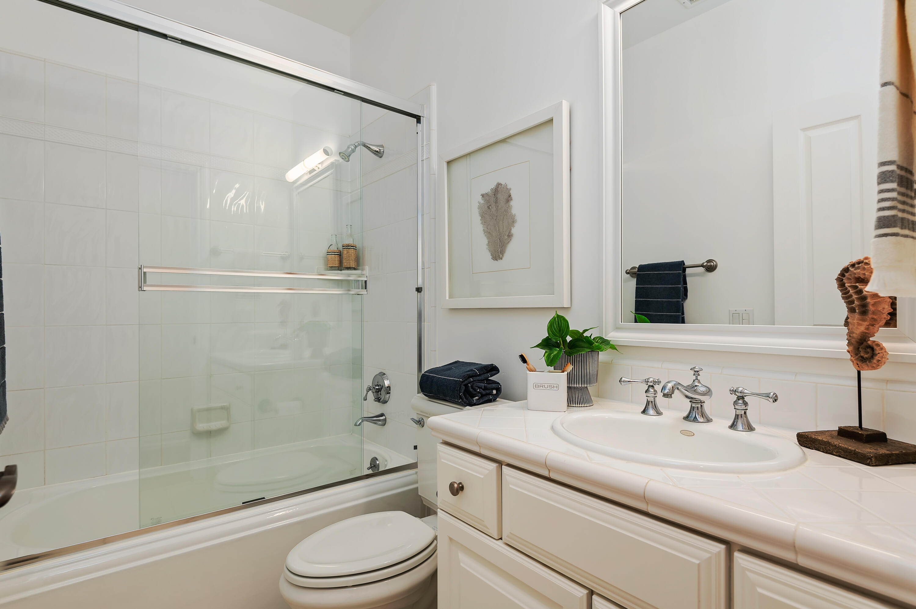 3848-2 Crescent Drive Santa Barbara, CA 93110 - Photo 22 of 32 a bathroom with a sink a toilet and a mirror