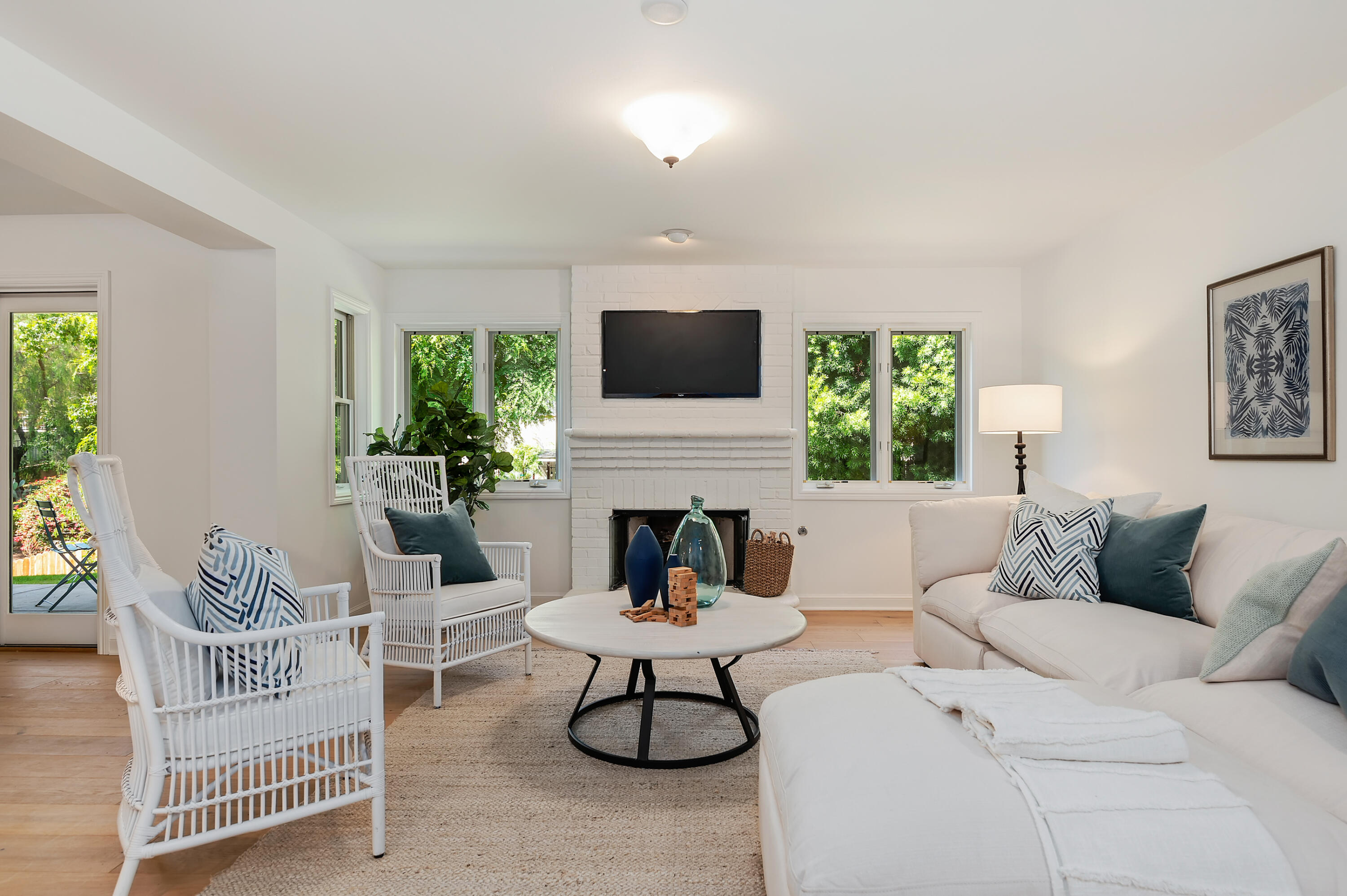 3848-2 Crescent Drive Santa Barbara, CA 93110 - Photo 23 of 32 a living room with furniture a fireplace and a flat screen tv