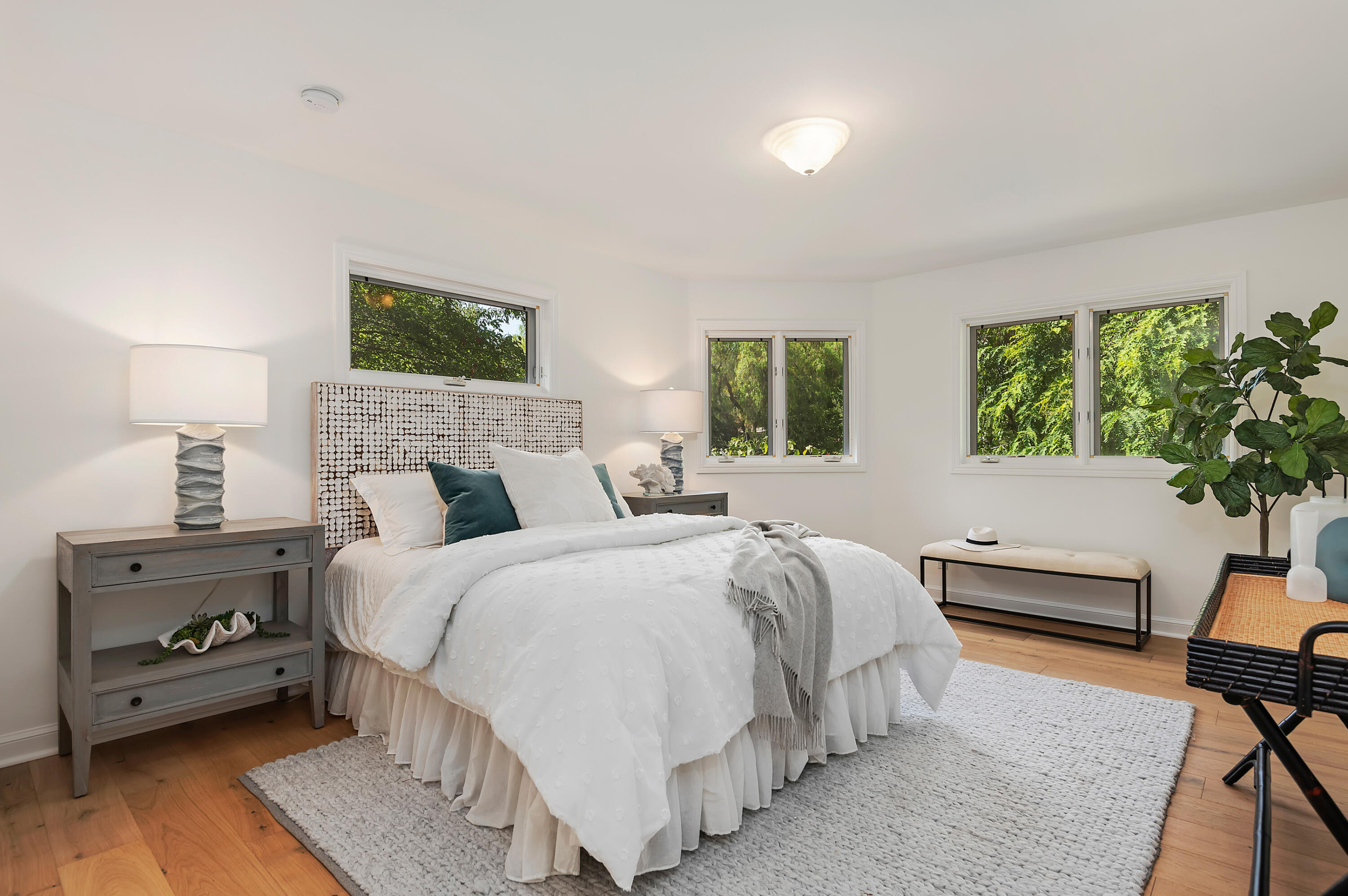 3848-2 Crescent Drive Santa Barbara, CA 93110 - Photo 26 of 32 a bedroom with a bed and a potted plant on the dresser