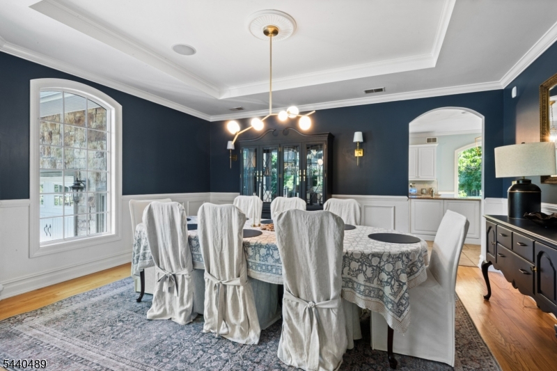99 East Lindsley Road Cedar Grove, NJ 07009 - Photo 14 of 41 a view of a dining room with furniture and wooden floor