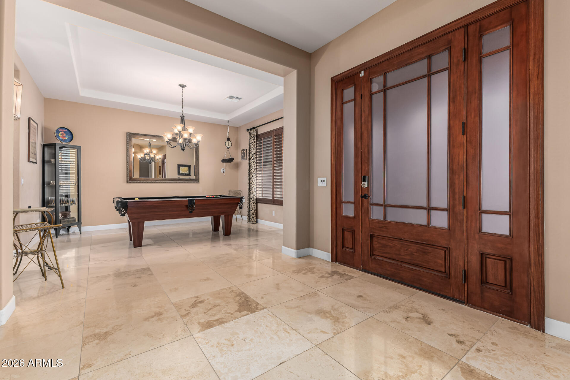 3139 East Harwell Road Phoenix, AZ 85042 - Photo 4 of 45 a view of hall with furniture and a chandelier