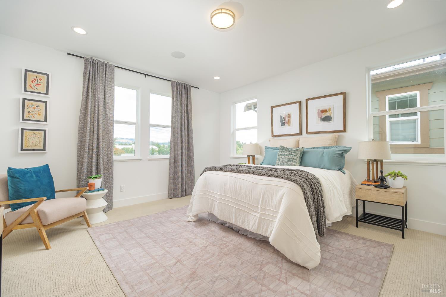 1201 Del Rancho Way Petaluma, CA 94954 - Photo 17 of 56 a bedroom with a bed and a couch