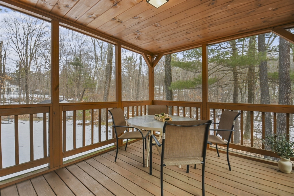 47 Scribner Road Tyngsboro, MA 01879 - Photo 13 of 38 a view of a city from a balcony with furniture