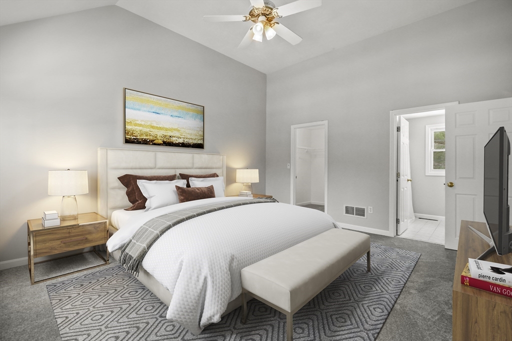 47 Scribner Road Tyngsboro, MA 01879 - Photo 18 of 38 a bedroom with a bed and a flat screen tv