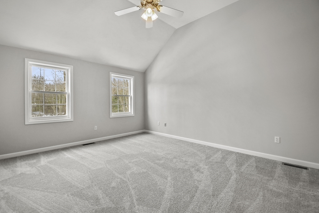 47 Scribner Road Tyngsboro, MA 01879 - Photo 19 of 38 an empty room with windows and chandelier fan