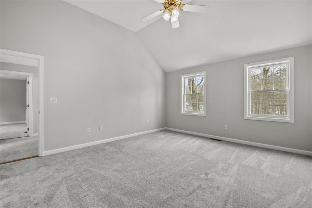 47 Scribner Road Tyngsboro, MA 01879 - Photo 20 of 38 an empty room with windows and chandelier fan