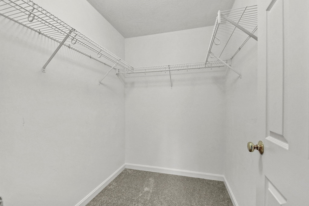 47 Scribner Road Tyngsboro, MA 01879 - Photo 21 of 38 a view of a room with racks on the wall