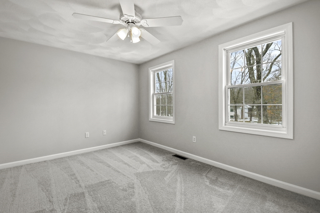 47 Scribner Road Tyngsboro, MA 01879 - Photo 23 of 38 a view of an empty room with a window